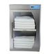 Stack of white towels inside a stainless steel towel warmer with a digital display on a white background.
