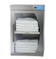 Stack of white towels inside a stainless steel towel warmer with a digital display on a white background.