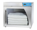 Enthermics warmer with folded white cloths inside on a white background