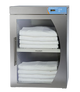 Stainless steel towel warmer with folded white towels inside on a white background